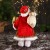 Дед Мороз "В колпачке и с коробкой подарков в горошек" 30 см, красно-зелёный
