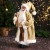 Дед Мороз "В колпачке, подарком и ягодами" 46 см, золото