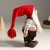 Кукла интерьерная "Дед Мороз в красном колпаке и вязанном свитером в узорах" 29 см