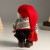 Кукла интерьерная "Дед Мороз в красном колпаке и вязанном свитером в узорах" 29 см